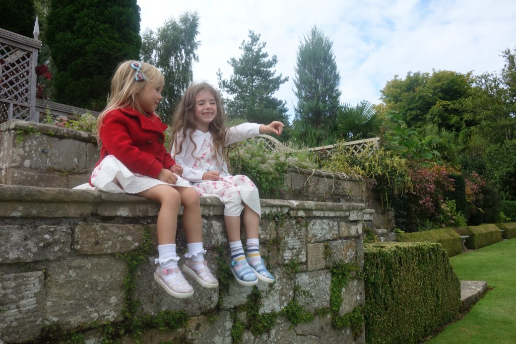 Sisters sitting together at Plas Newydd National Trust 