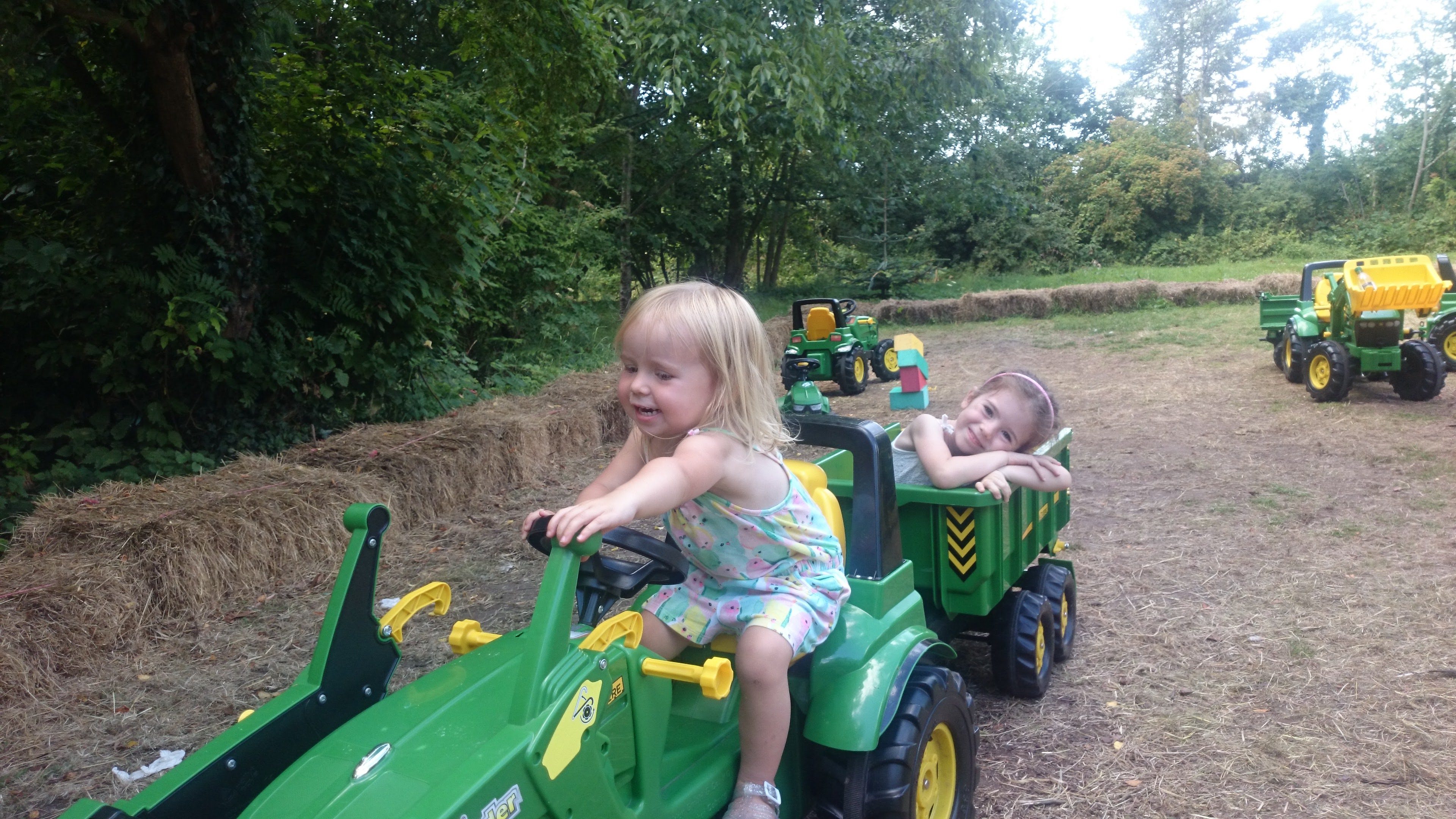 Meme and Harri on a toy tractor